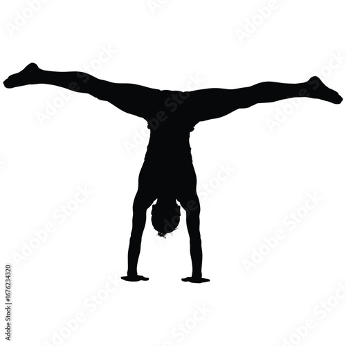 Woman performing a wide legged handstand silhouette