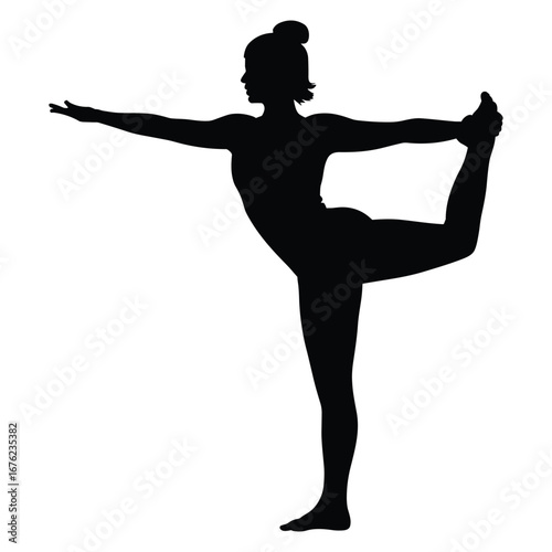Woman performing natarajasana yoga pose silhouette