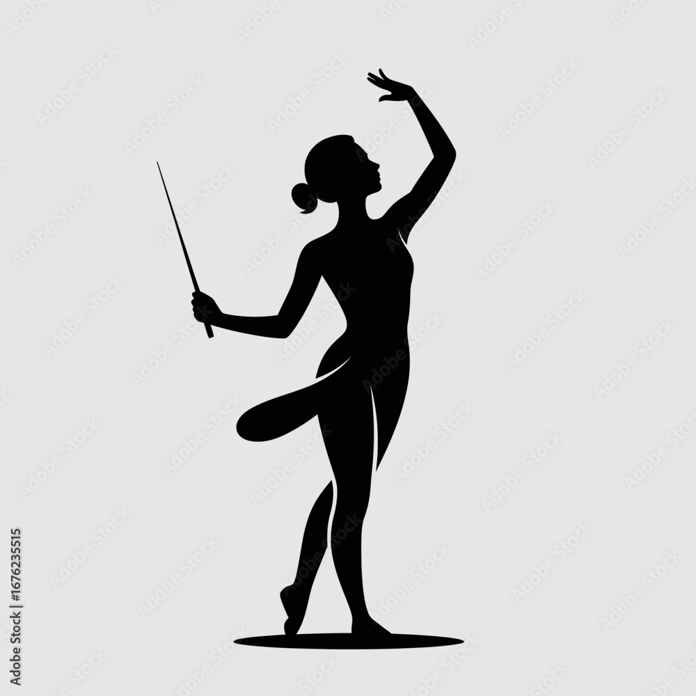 Obraz premium Silhouette of a graceful ballerina performing a ballet pose with a wand