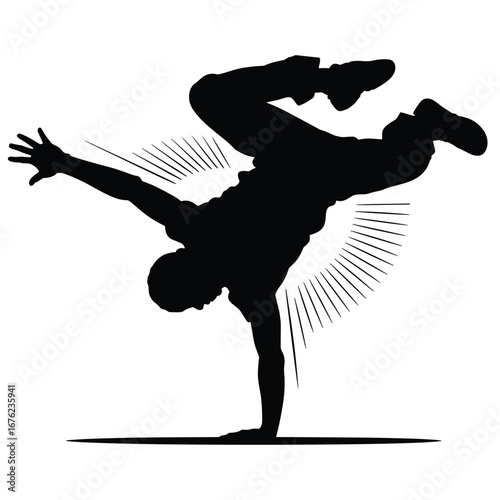 Dynamic breakdancer performing an acrobatic move in silhouette
