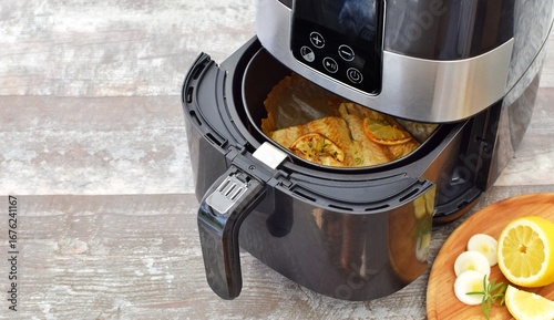 Cooking fish in a deep fryer.