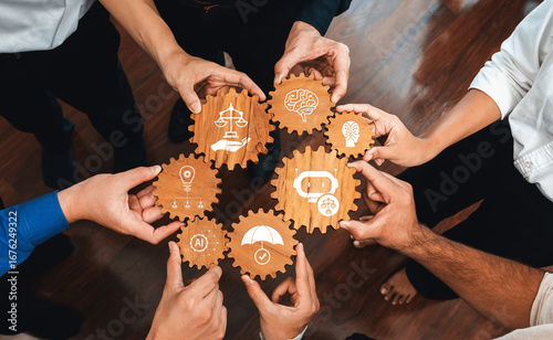 A diverse group collaborates by holding gears with symbols representing ethics, creativity, and protection in a harmonious setting, highlighting teamwork and innovation. Amity