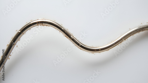 Curved Metal Straw on White Background