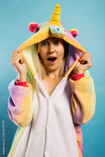 Quadro em tela young and cheerful animator girl in a bright kigurumi is entertaining children at a party