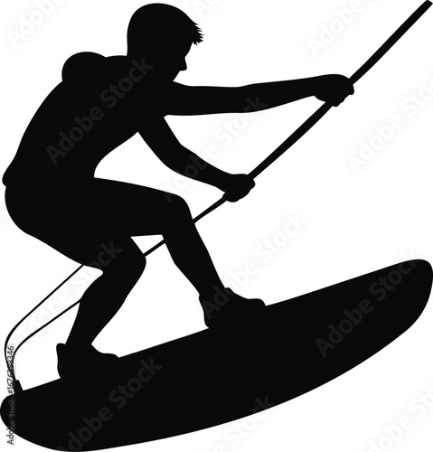 Dynamic silhouette of a person wakeboarding in motion performing a trick on the water silhouette