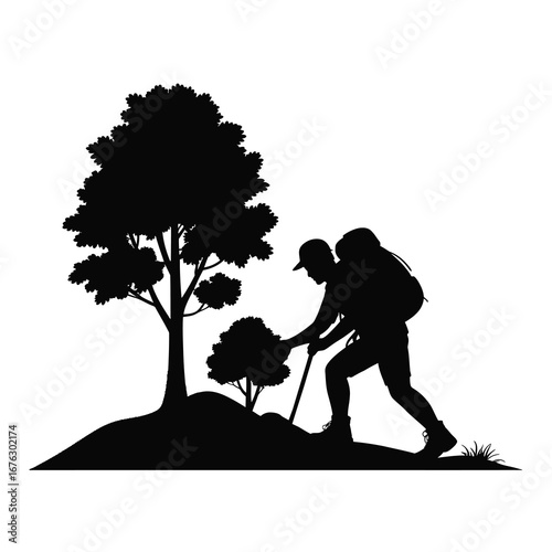 Silhouette of a hiker with a backpack and walking stick near a tree in a natural landscape