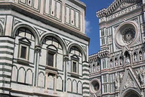 closeup of the Cathedral of Saint Mary of the Flowers, Cattedrale di Santa Maria del Fiore, Duomo di Firenze, and the baptistery. Florence, Italy.