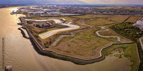 Drone shot of historic Tilbury Fort in Essex, UK, showcasing its star-shaped defensive design by the Thames. Great for themes like heritage, tourism, architecture, and military history visuals