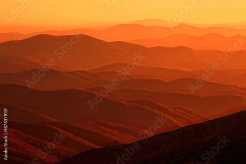 Sunset view of mountain ranges.  Layered, warm tones