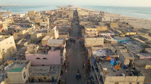 SENEGAL - 7.16.2025 - Terrific aerial footage moving up a busy road bound for the beach on Senegal's Island of Saint-Louis.