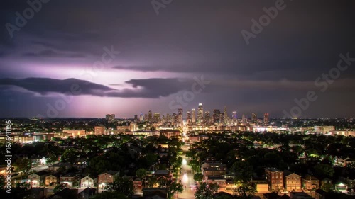 Wallpaper Mural Dramatic Lightning Strike Over City Skyline at Night, Illuminated Buildings and Dark Storm Clouds Torontodigital.ca