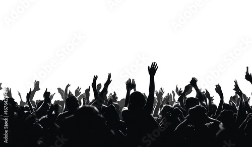 Silhouetted crowd with raised hands