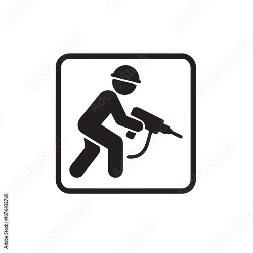Worker operating drill silhouette