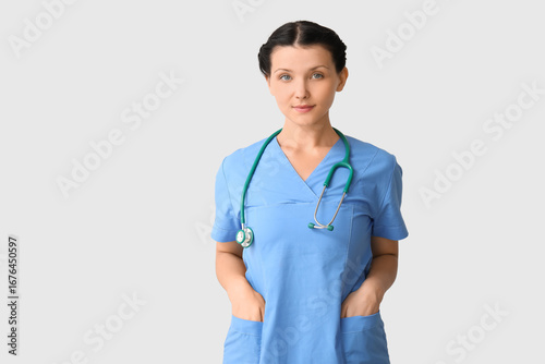 Female doctor on light back...