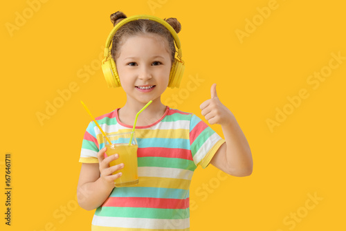Cute little girl with glass...