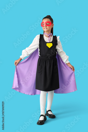Happy schoolgirl dressed as...
