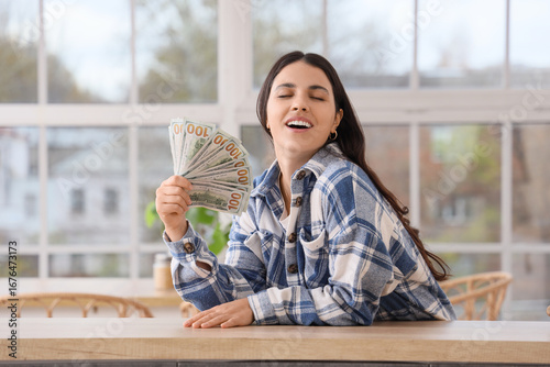 Beautiful woman with dollar...