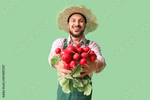 Happy male farmer with ripe...