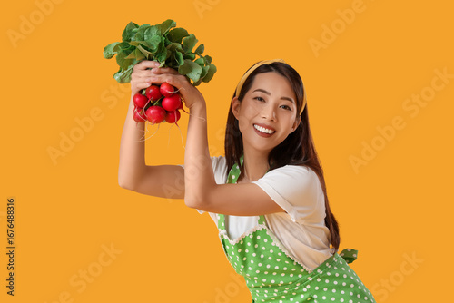 Young Asian housewife with ...