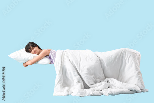 Young woman with pillow and...