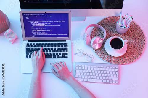 Female programmer's hands w...