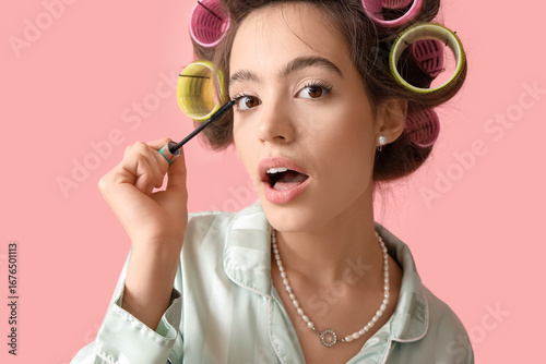 Young woman in pajamas with...