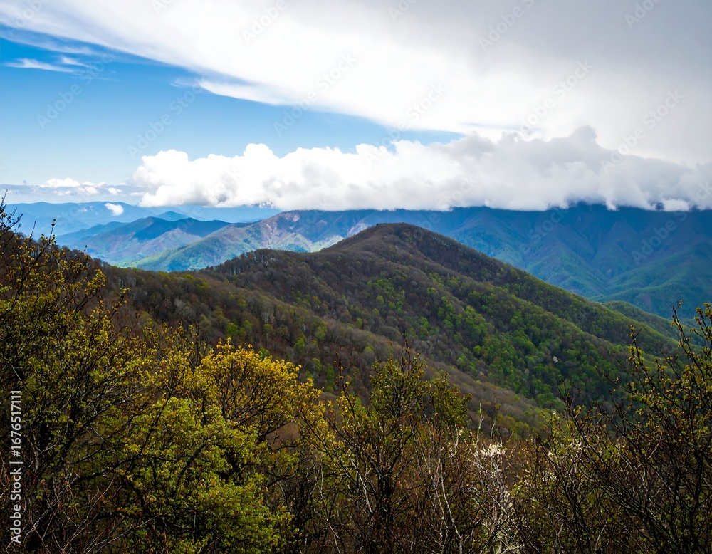 Fototapeta premium Mountain vista with layered hills and clouds