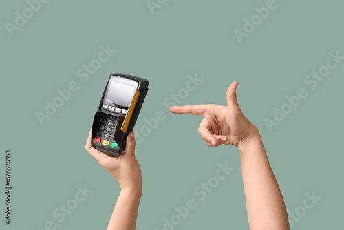 Female hand pointing at pay...