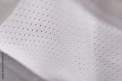Macro detail of white breathable perforated fabric for sportswear