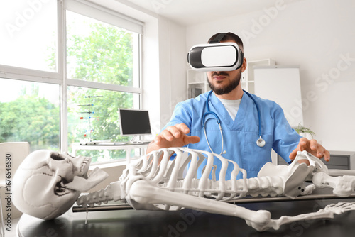 Male doctor in VR glasses w...