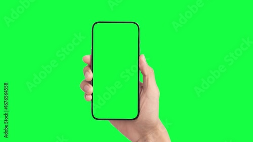 Woman hand holding the smartphone on green screen chroma key background. Phone, green screen, green screen of phone, smartphone green screen, 
animation hand and mobile phone mockup 