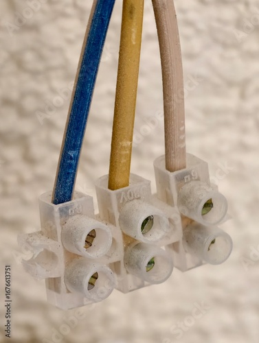 A close-up shot of an electrical wire connection