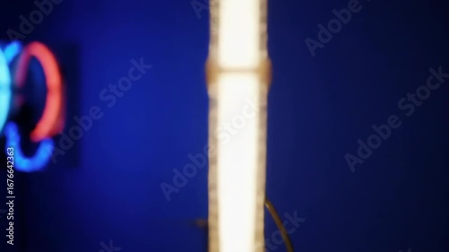 Lit Fan Against Blue Backdrop, Artistic Lighting