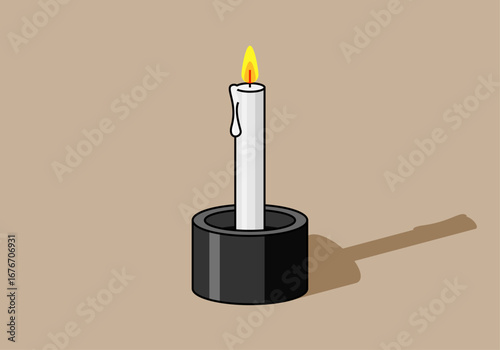 Vela blanca encendida con vaso negro 