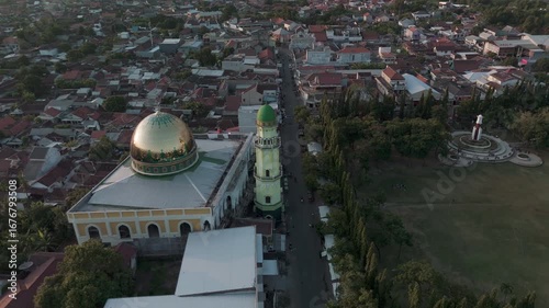 Aerial View of a Charming Cityscape Featuring a Stunning Mosque and Lush Green Park