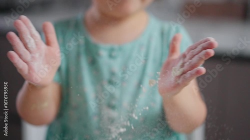 Wallpaper Mural A Child's Playful Exploration with Flour: Captivating Moments of Joy and Creativity in the Kitchen Showcasing a Tiny Baker in Action Torontodigital.ca