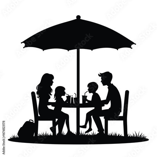 Family silhouette dining under umbrella on grass outdoor dining