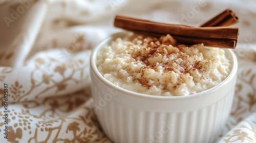 Wallpaper Mural Creamy rice pudding in white bowl, sprinkled with cinnamon and topped with cinnamon sticks Torontodigital.ca
