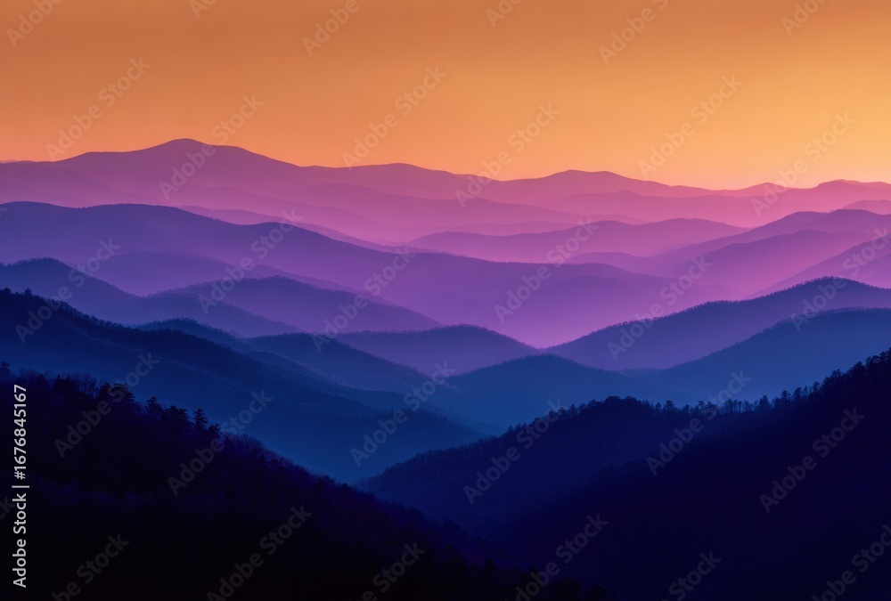 Obraz premium Vivid Sunset Over Mountain Ranges with Layered Silhouettes and Warm Color Gradient