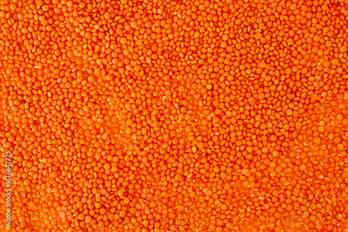 Close-Up View of Bright Orange Lentils in Full Frame