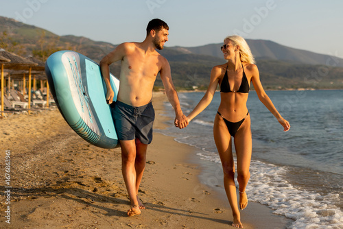 Couple enjoys a sunset stro...