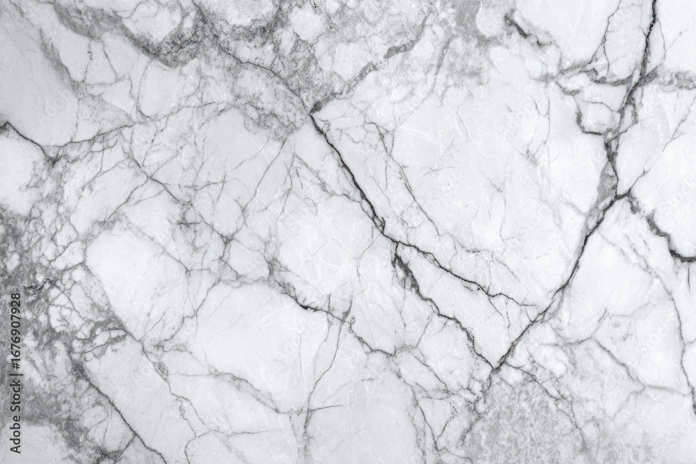 Obraz premium Close-up view of white marble with prominent veins and cracks