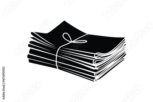Stack of black fabric napkins tied with twine