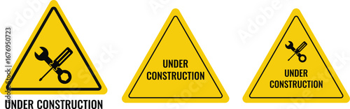 Under construction. traffic warning sign board. Board attract attention. screwdriver and wrench repair sign. safety and maintenance work area caution
