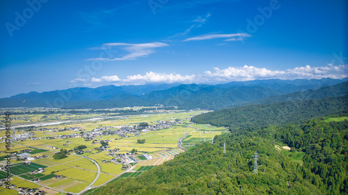 View of Toyama Bay, the Kurobe River alluvial fan, the Hokuriku Shinkansen, and farms from Kurobe City in eastern Toyama Prefecture, Japan