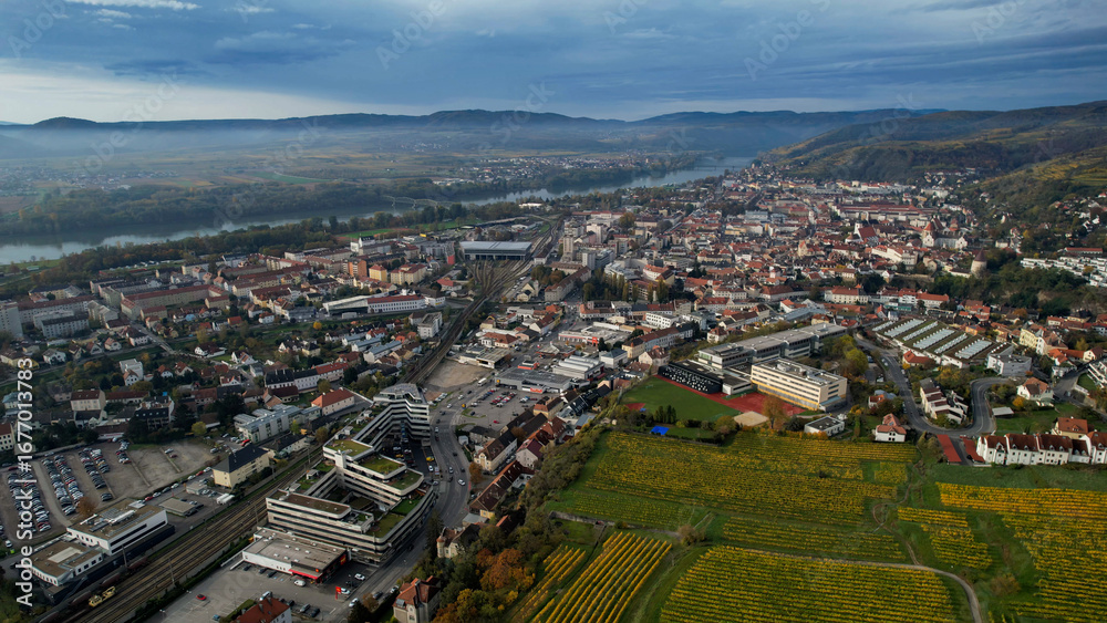 Fototapeta premium Aerial wide view around the city Krems an der Donau in Austria on a sunny autumn morning day