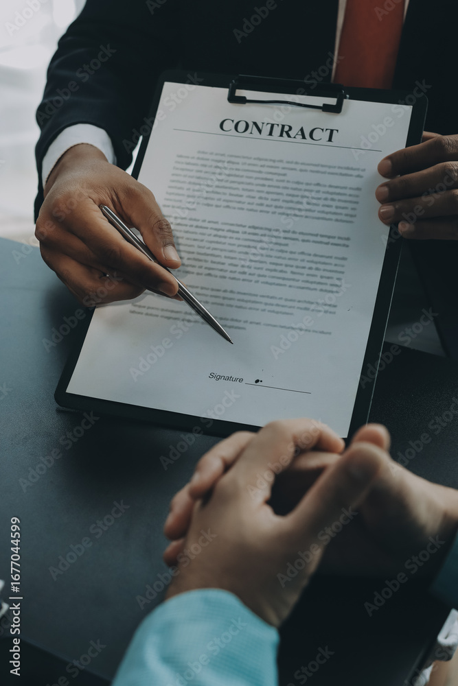 Fototapeta premium Lawyer explained to the client about the law that must be brought against the court case.