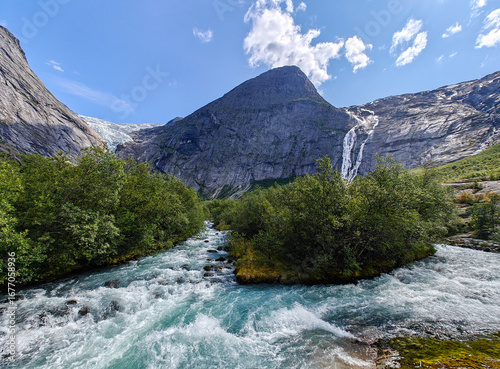 Briksdal glacier with a mountain river in the foreground.  Olden, Norway