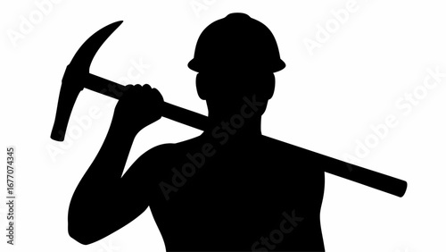 Silhouette of a miner with hard hat carrying a pickaxe over his shoulder in a black and white image