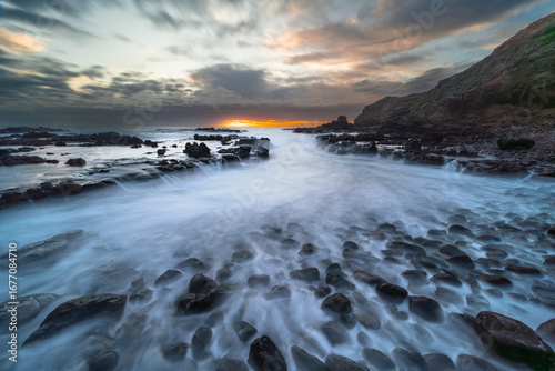 Coastal Inlet at Sunset with Long Exposure Water